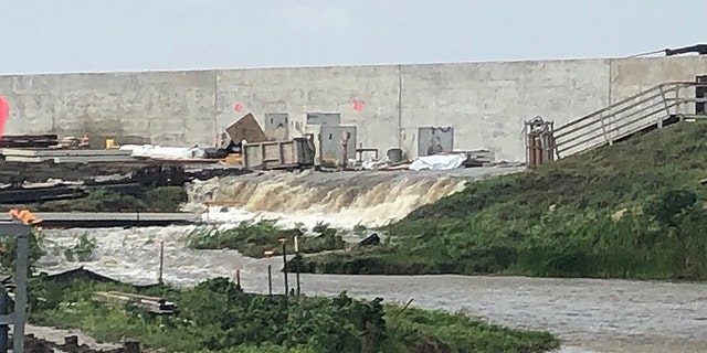 The water passes over the dike at the Point Celeste pumping station in Louisiana while Hurricane Barry lands.