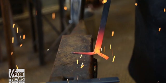 "The blacksmith is just a guide for the tools to move the metal," Trattner explains.