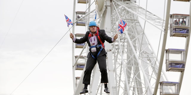 Mayor of London Boris Johnson got stuck on a zip-line during BT London Live in Victoria Park on August 01, 2012 in London, England.