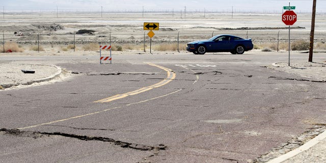 An earthquake-damaged street is seen Saturday, July 6, 2019, in Trona, Calif.