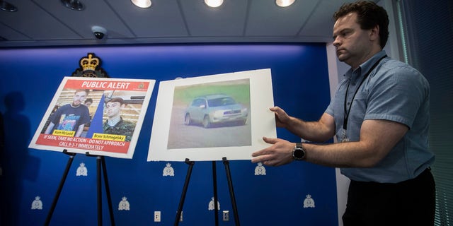 Security camera images of Kam McLeod, 19, and Bryer Schmegelsky, 18, and a Toyota RAV4 SUV are placed on display before an Royal Canadian Mounted Police news conference in Surrey, British Columbia, on Tuesday, July 23, 2019.