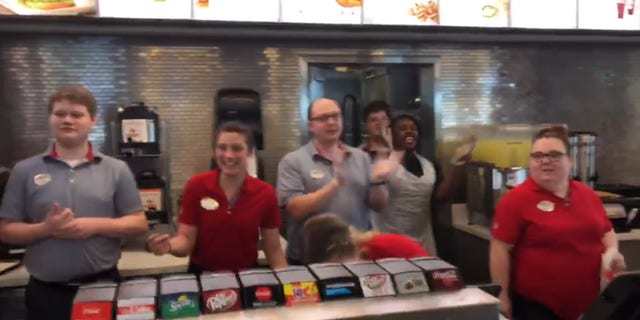 Customers and staffers joined in to sing along to the group's impromptu rendition of Bill Withers' "Lean on Me."