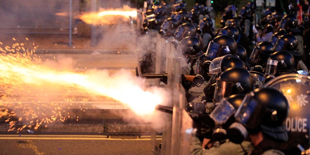 Hong Kong police fire tear gas at protesters in Sai Wan, Hong Kong on Sunday, July 28, 2019. 