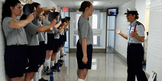 Yankee 2 company Cadre Mary Budri, right, puts female swabs through their paces during Day One of Swab Summer at the U.S. Coast Guard Academy Monday. (Sean D. Elliot/The Day via AP)