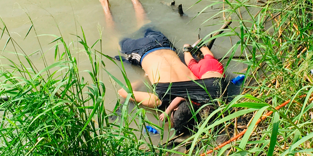 The bodies of Salvadoran migrant Oscar Alberto Martínez Ramírez and his nearly 2-year-old daughter Valeria lie on the bank of the Rio Grande in Matamoros, Mexico, Monday, June 24, 2019, after they drowned trying to cross the river to Brownsville, Texas. This photograph was first published in the Mexican newspaper La Jornada.