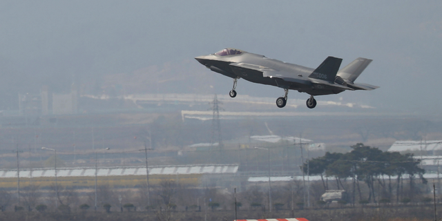 In this March 29, 2019, photo, a U.S. F-35A fighter jet prepares to land at Chungju Air Base in Chungju, South Korea. (Kang Jong-min/Newsis via AP)