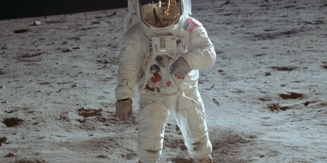 In this July 20, 1969 photo made available by NASA, astronaut Buzz Aldrin, lunar module pilot, walks on the surface of the moon during the Apollo 11 extravehicular activity.