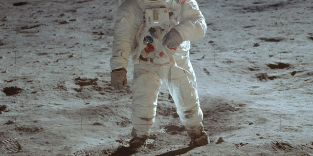 In this July 20, 1969 photo made available by NASA, astronaut Buzz Aldrin, lunar module pilot, walks on the surface of the moon during the Apollo 11 extravehicular activity.