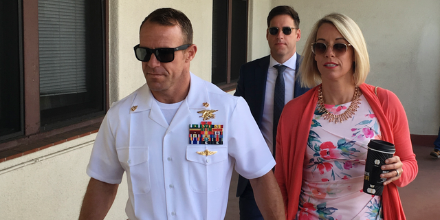 Navy Special Operations Chief Edward Gallagher, left, walking with his wife, Andrea Gallagher, this past Monday.