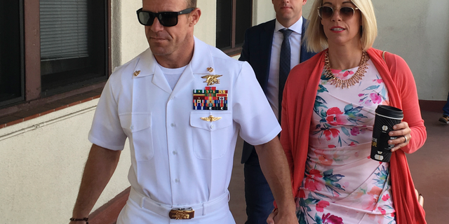 Navy Special Operations Chief Edward Gallagher, left, walking with his wife, Andrea Gallagher, this past Monday.