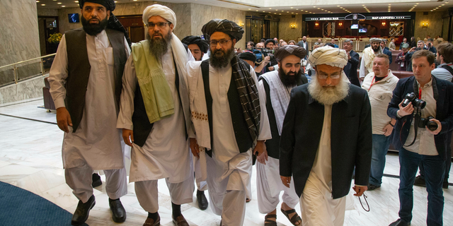 Mullah Abdul Ghani Baradar, the Taliban group's top political leader, third from left, arrives with other members of the Taliban delegation for talks in Moscow, Russia, in May 2019. (AP/Alexander Zemlianichenko, File)