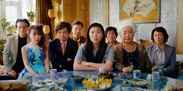 This image released by A24 shows Awkwafina, center, in a scene from "The Farewell." (A24 via AP)