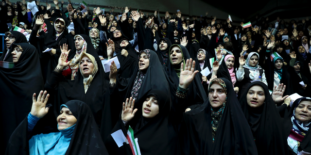 Veiled Iranian women attend a ceremony in support of the observance of the Islamic dress code for women, in Tehran, Iran, July 11, 2019. A few daring women in Iran's capital have been taking off their mandatory headscarves, or hijabs, in public, risking arrest and drawing the ire of hard-liners. Many others stopped short of outright defiance and opted for loosely draped scarves that show as much hair as they cover. More women are pushing back against the dress code imposed after the 1979 Islamic Revolution, and activists say rebelling against the hijab is the most visible form of anti-government protest in Iran today.