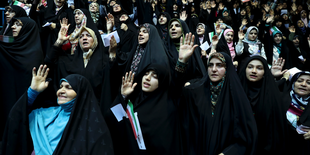 Veiled Iranian women attend a ceremony in support of the observance of the Islamic dress code for women, in Tehran, Iran, July 11, 2019. A few daring women in Iran's capital have been taking off their mandatory headscarves, or hijabs, in public, risking arrest and drawing the ire of hard-liners. Many others stopped short of outright defiance and opted for loosely draped scarves that show as much hair as they cover. More women are pushing back against the dress code imposed after the 1979 Islamic Revolution, and activists say rebelling against the hijab is the most visible form of anti-government protest in Iran today.