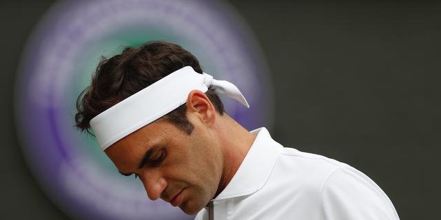 Roger Federer is dejected after losing a point to Serbia's Novak Djokovic during the men's singles final match of the Wimbledon Tennis Championships in London, Sunday, July 14, 2019. (Adrian Dennis/Pool Photo via AP)