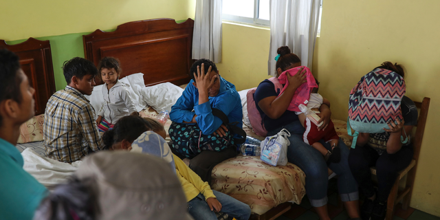 Central American migrants sit together in a Latino hotel room during a raid by Mexican immigration agents in Veracruz, Mexico, last month. Under increasing pressure from the United States to reduce the flow of hundreds of thousands of Central Americans through Mexican territory, the Mexican government has strengthened its enforcement of the law. (AP Photo / Felix Marquez)