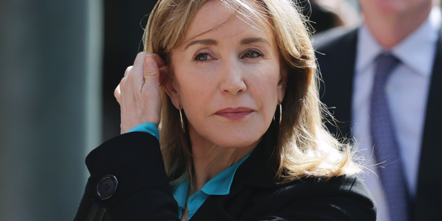 Actress Felicity Huffman arrives at federal court in Boston to face charges in a nationwide college admissions bribery scandal.