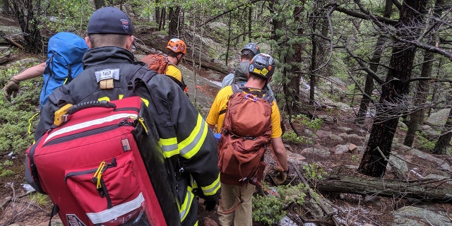 A woman told Colorado she was seeking shelter with a group of hikers when the lightning struck nearby.