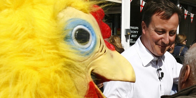 Conservative Party leader David Cameron walks around Tamworth in Staffordshire followed by a man dressed as a chicken, working for the Daily Mirror newspaper. (Photo by Johnny Green/PA Images via Getty Images)