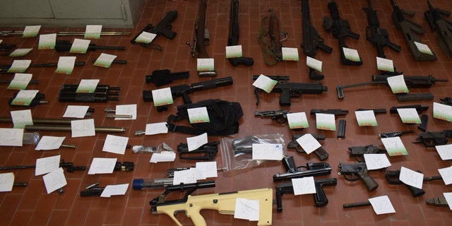 Italian police seized a cache of weapons in their raid.