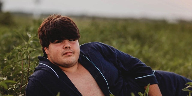 "He's stubborn. He absolutely refused to do anything except for in his bathrobe. I didn't want to do it, and I couldn't stop laughing," the photographer said of her subject.