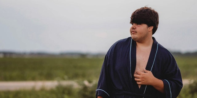Photographer Tiffany Clark didn’t expect anything out of the ordinary while recently preparing her cousin, high schooler Evan Dennison, pictured, for his close-up.