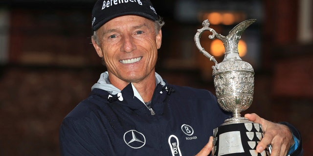 Bernhard Langer poses with the trophy after winning the senior Open golf tournament at Royal Lytham & St Annes Golf Club, in Lytham, England, Sunday July 28, 2019. (Peter Byrne/PA via AP)