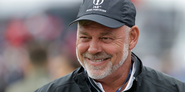 Northern Ireland's Darren Clarke smiles as he speaks to colleagues don the practice range ahead of the start of the British Open golf championships at Royal Portrush in Northern Ireland, Wednesday, July 17, 2019. The British Open starts Thursday. Clarke will hit the first ball at the start of the Open Thursday. (AP Photo/Matt Dunham)