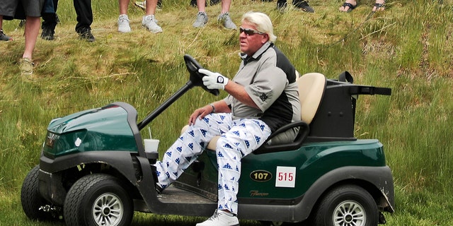 John Daly drives his cart off the 16th tee during the second round of the PGA Championship golf tournament, at Bethpage Black in Farmingdale, N.Y on May 17, 2019.