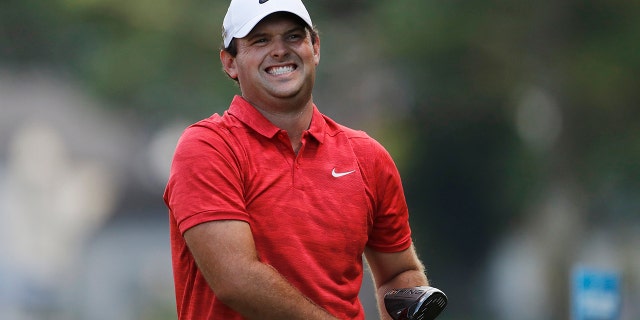 Patrick Reed reacts to his tee shot during the Rocket Mortgage Classic, June 29, 2019, in Detroit.