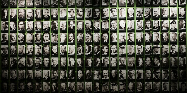 On this Friday, July 12, 2019 photo, pictures of co-conspirators of the failed July 20, 1944 attempt to assassinate Adolf Hitler are displayed at the exhibition of the German Resistance Memorial Center inside the Bendlerblock building a part of the German defensive ministry in Berlin. (AP Photo/Markus Schreiber)