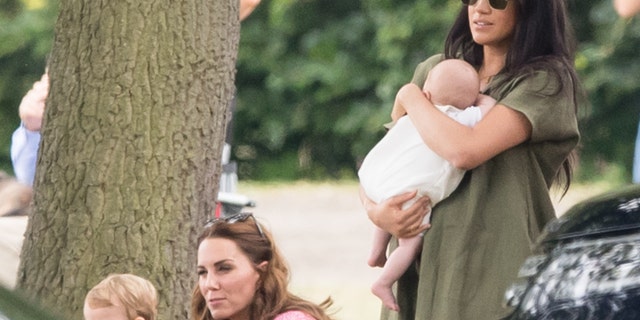 Meghan, Duchess of Sussex and Archie Harrison, with Catherine, Duchess of Cambridge and Prince Louis