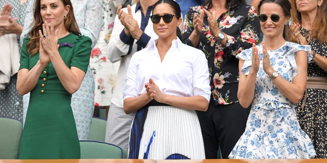 Catherine, Duchess of Cambridge; Meghan, Duchess of Sussex; and Pippa Matthews, from left, in the Royal Box give a standing ovation to the winner Halep.