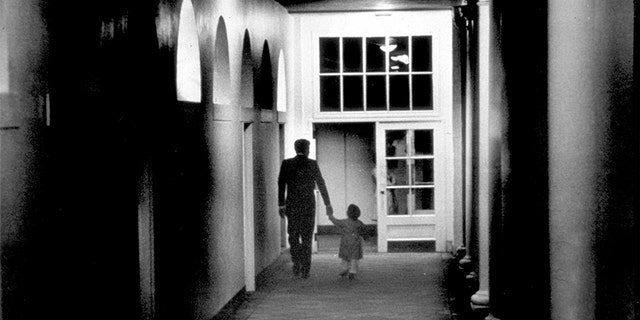 John Kennedy Jr. playing in the Oval Office at the White House, Washington, D.C., Oct. 15, 1963. (Photo by Liaison Agency/Getty)