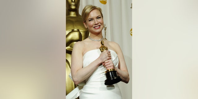 Renee Zellweger poses with her Oscar for Best Supporting Actress on Feb. 29, 2004, in Hollywood, Calif. (Photo by Frederick M. Brown/Getty Images)