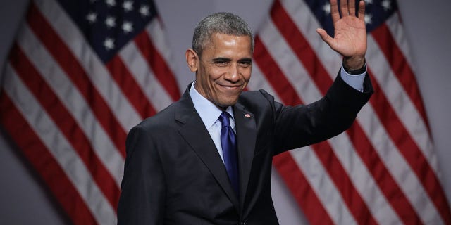 President Barack Obama waves after he spoke during the SelectUSA Investment Summit March 23, 2015, in National Harbor, Maryland. The summit brought together investors from around the world to showcase the diversity of investment opportunities available in the U.S.