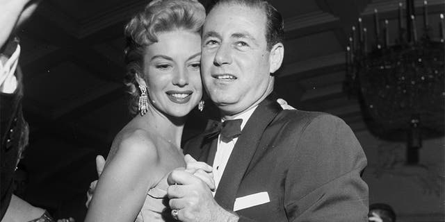 Kathleen Hughes dances with Stanley Rubin during a dinner party in Los Angeles, Calif., circa 1954. (Photo by Earl Leaf/Michael Ochs Archives/Getty Images)