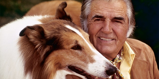 Lassie posed with owner and trainer, Rudd Weatherwax. — Getty
