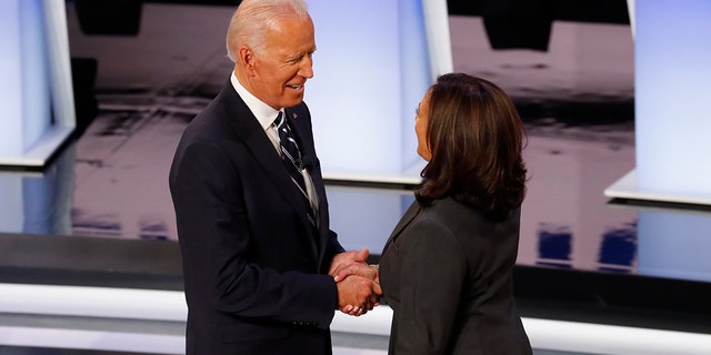 Former Vice President Joe Biden and Sen. Kamala Harris, D-Calif., shake hands before the second of two Democratic presidential primary debates hosted by CNN Wednesday, July 31, 2019, in the Fox Theatre in Detroit.