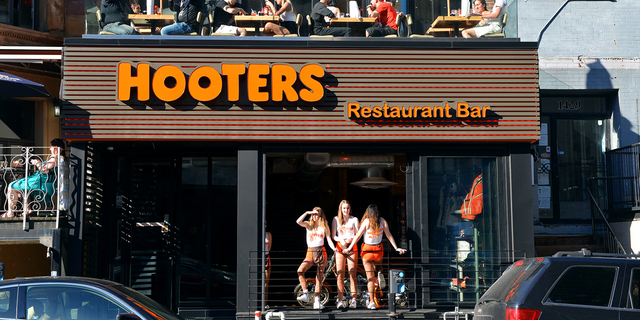 The line includes eight different spirits, including a corn-based Hooters Vodka, Hooters Gin, a Hooters Light Rum and a Hooters Dark Rum.