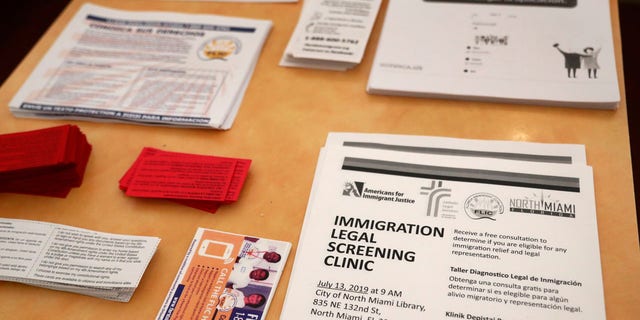 Leaflets in English and Spanish are mounted stacked at a nearby restaurant before immigration advocates gather and distribute them on Thursday, July 11, 2019, in the Little Havana district of Miami.