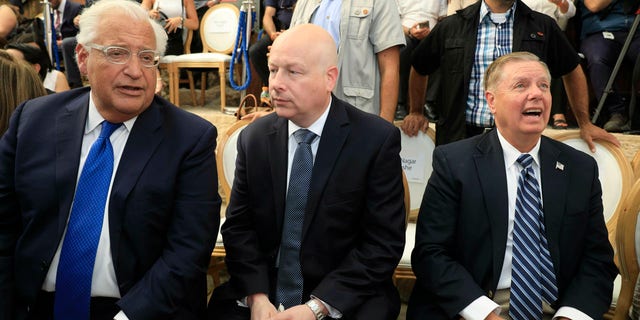 U.S. Ambassador to Israel David Friedman, left, White House Mideast envoy Jason Greenblatt, center, and Lindsey Graham, U.S. Senator from South Carolina, attend the opening of an ancient road at the City of David, a popular archaeological and tourist site in the Palestinian neighborhood of Silwan in east Jerusalem. The site is located on what many believe to be the ruins of the biblical King David's ancient capital and see as centerpieces of ancient Jewish civilization, but critics accuses the operators of pushing a nationalistic agenda at the expense of local Palestinian residents. (AP Photo/Tsafrir Abayov, Pool)