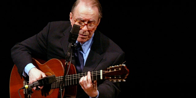 In this June 18, 2004 file photo, Brazilian composer Joao Gilberto performs at Carnegie Hall, in New York. (AP Photo/Mary Altaffer, File)