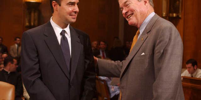 Eugene Scalia pictured in 2001 with then-Sen. Kit Bond, R-Mo. (Tom Williams/Roll Call/Getty Images, File)