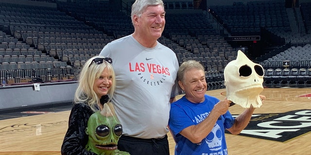 Bill Laimbeer, center, coach of the WNBA's Las Vegas Aces basketball team, poses for photos with Kathy Coleman and Wesley Eure in Las Vegas last month. Laimbeer spent a season playing a Sleestak on "Land of the Lost."