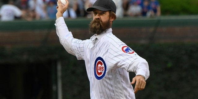 Alligator trapper Frank Robb throws out a ceremonial first pitch before a baseball game between the Chicago Cubs and Cincinnati Reds on Tuesday, July 16, 2019 at Wrigley Field in Chicago. (AP Photo/Paul Beaty)