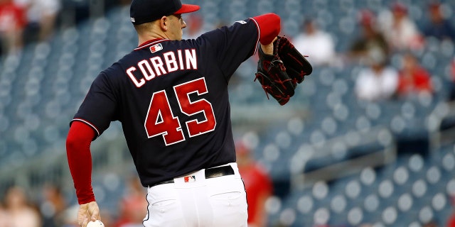 Washington Nationals starting pitcher Patrick Corbin warms up before a baseball game against the Miami Marlins, Tuesday, July 2, 2019, in Washington. Corbin wore number 45 in remembrance of Los Angeles Angels pitcher Tyler Skaggs, who was found dead on Monday. (AP Photo/Patrick Semansky)