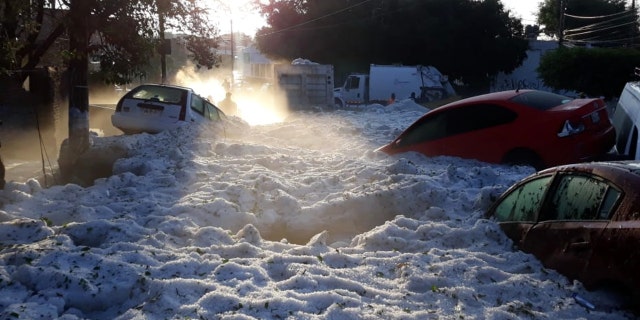 The storm struck Guadalajara, Mexico early Sunday, trapping residents in a deluge of ice up to 5 feet deep.