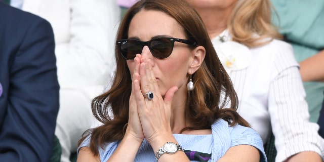 LONDON, ENGLAND - JULY 14: Catherine, Duchess of Cambridge in the Royal Box on the center court at the men's finals day of the Wimbledon Tennis Championships at the All England Lawn Tennis and Croquet Club on July 14, 2019 in London, England . 