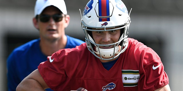 Buffalo Bills quarterback Josh Allen runs a scrambling drill during practice at the NFL football team's training camp in Pittsford, N.Y., Friday, July 26, 2019. (AP Photo/Adrian Kraus)